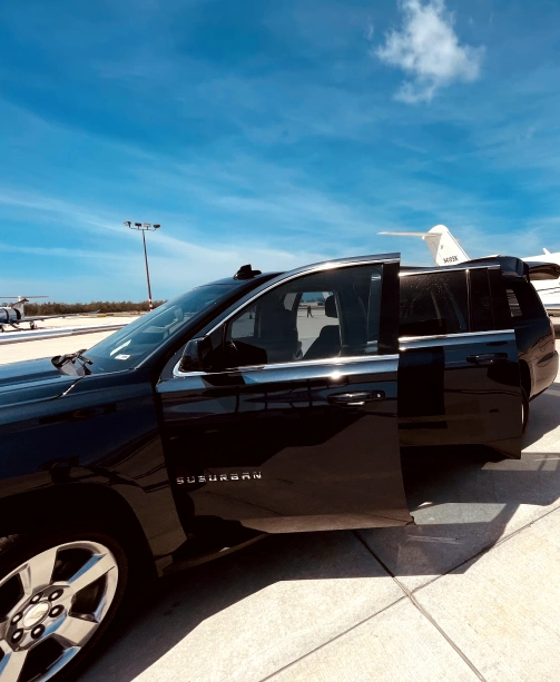 Naples tourist transportation SUV near private airport terminal